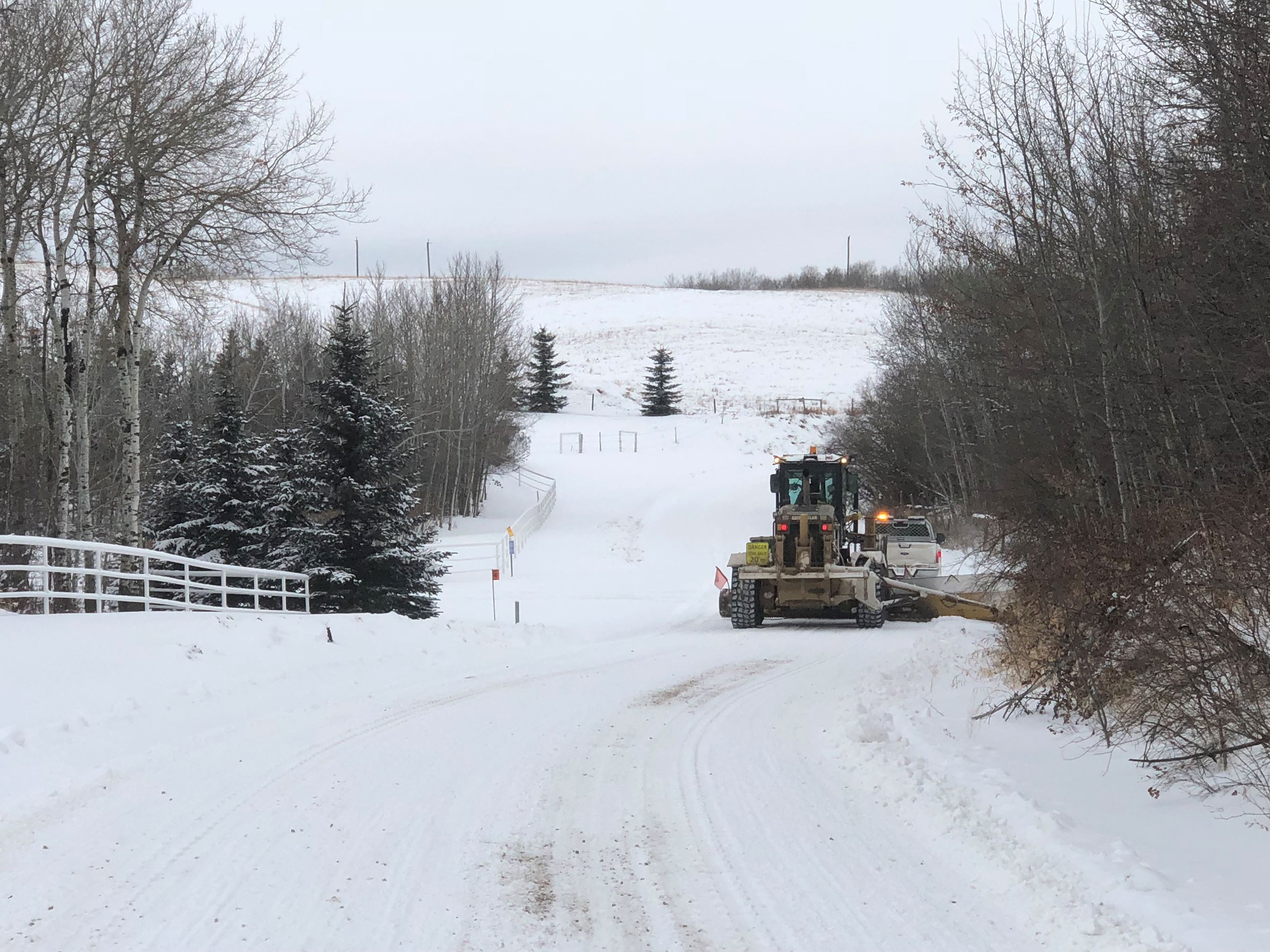 Grader and Pilot Vehicle